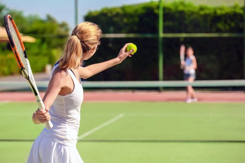 Players on grass tennis court at Aloha Tennis Club in Nueva Andalucia, Marbella