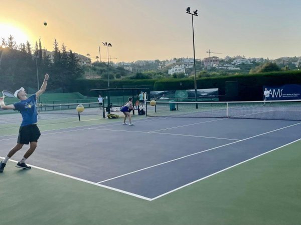 Players on a floodlit court at Bel-Air Tennis and Padel Club in Estepona