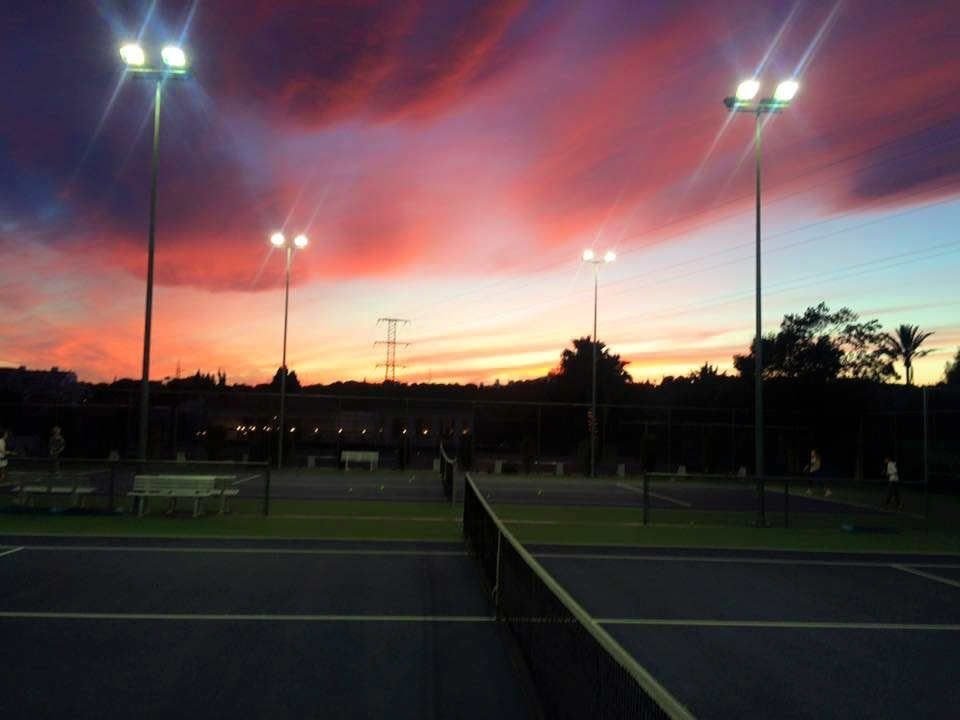 Floodlit tennis courts at sunset at Tennis Brothers Marbella