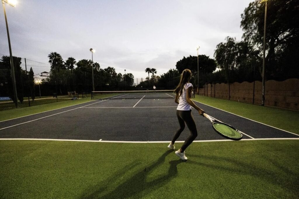 Tennis player on a court at Villa Padierna Racquet Club near Marbella